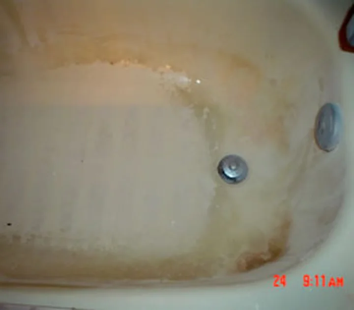 Bathtub before cleaning, from a Jean's Cleaning Services job photo